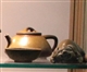 Dark-red enameled pottery teapot